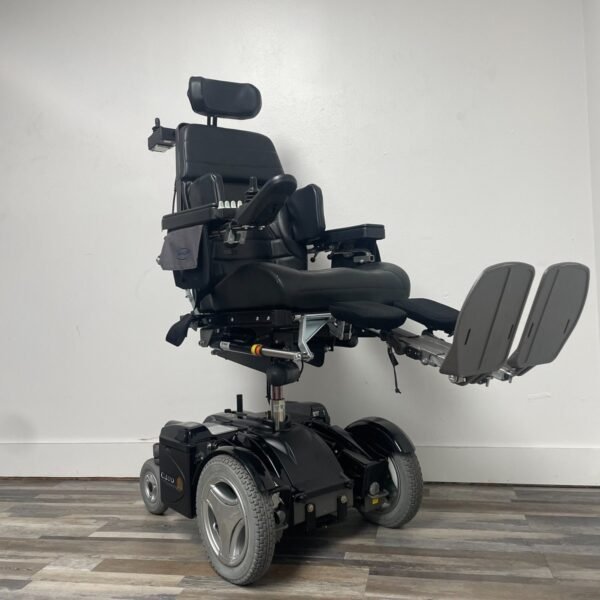 permobil c400 power wheelchair with power tilt,recline,legs and seat elevation.