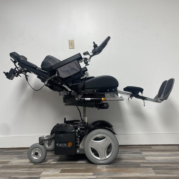 permobil c400 power wheelchair with power tilt,recline,legs and seat elevation.