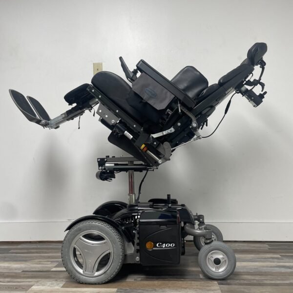 permobil c400 power wheelchair with power tilt,recline,legs and seat elevation.