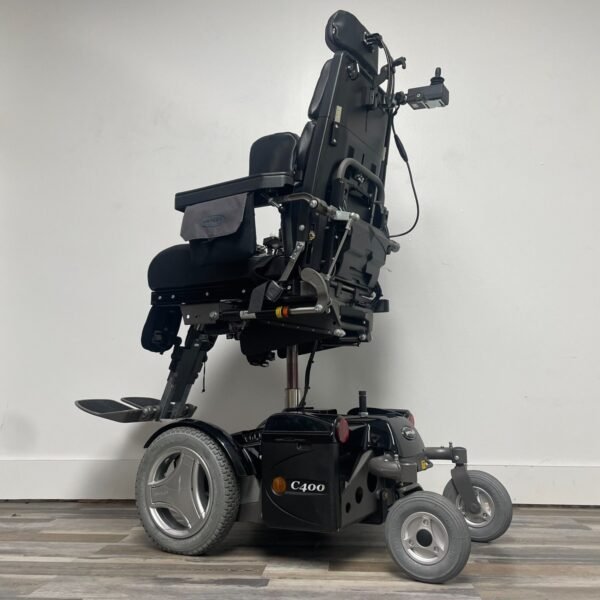permobil c400 power wheelchair with power tilt,recline,legs and seat elevation.