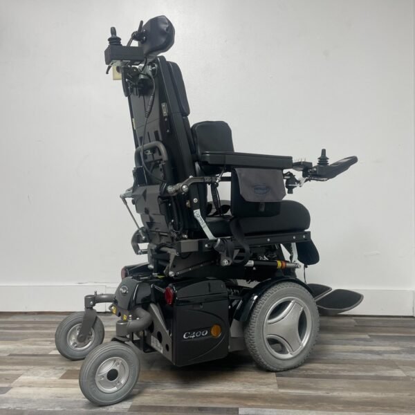 permobil c400 power wheelchair with power tilt,recline,legs and seat elevation.