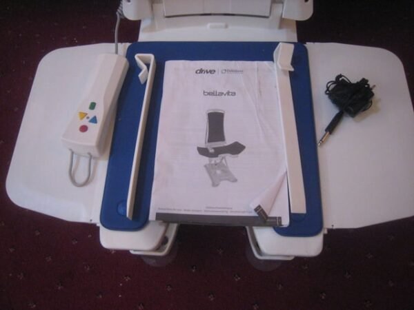 unused drive bellavita bath lift. hand control and battery charger. side flap guides